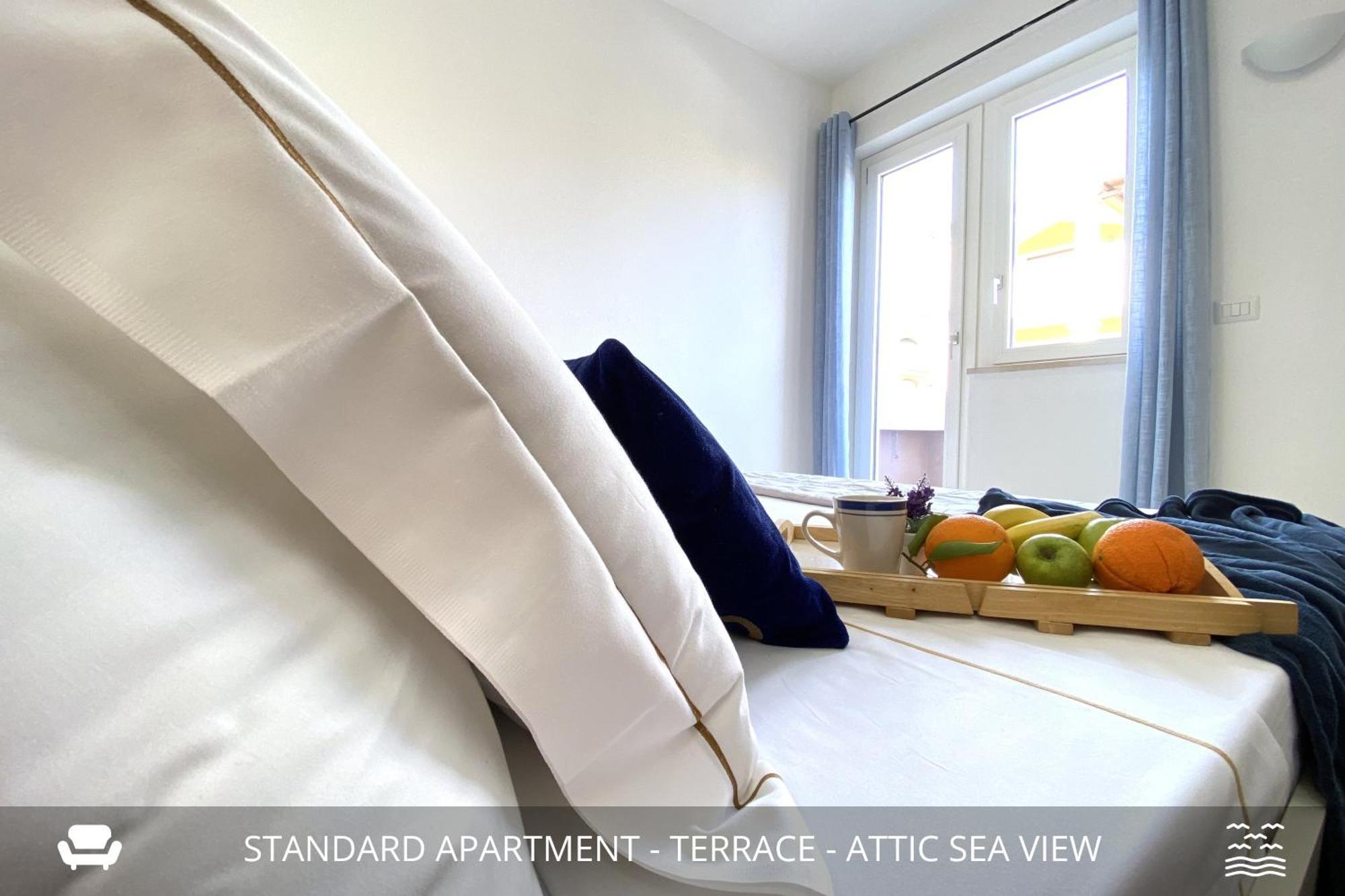 Homey Experience - Design Apartments Golfo Aranci Bagian luar foto